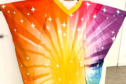 A vibrant jumper worn by late Benidorm star Bobby Knutt sold for £487 in an auction by creator Derren Litten, raising funds for a friend battling a rare bone disease.