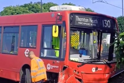 A bus collided with a car in Croydon and crashed onto tram tracks, injuring a passenger and halting tram service for six hours as emergency crews rushed to the scene.