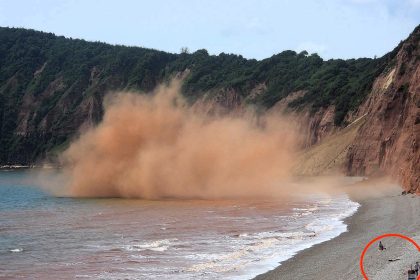 A sunbather narrowly avoided disaster as a cliff collapsed just 50 yards away on Jacob's Ladder beach in Sidmouth, a spot known for sudden and dangerous rockfalls.