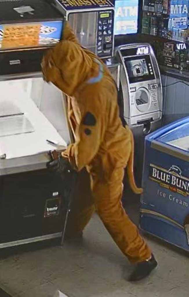 Scooby-Doo-costumed thief wanted after Alabama store raid - suspect stole cash but no snacks as police share images and appeal for help to unmask the mystery crook.