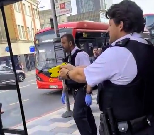 Police aimed tasers at an unarmed man in Ilford after reports of a knife fight. No weapons were found and no arrests made as stunned locals watched the tense standoff.