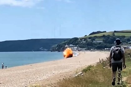 A bomb was safely detonated by the Royal Navy at Slapton Sands, Devon, stunning beachgoers as white smoke and debris filled the air during the dramatic operation.