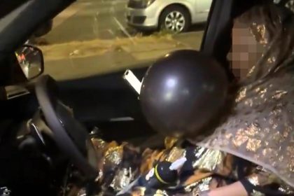 Brazen woman spotted on Southall road with balloon in mouth and gas canisters in car sparks outrage and safety concerns from shocked locals and social media users.