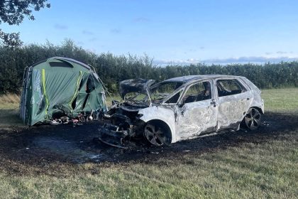 Campers were left stunned after an electric car burst into flames at a Devon campsite, torching a nearby tent. Fire crews contained the blaze, but both were destroyed.