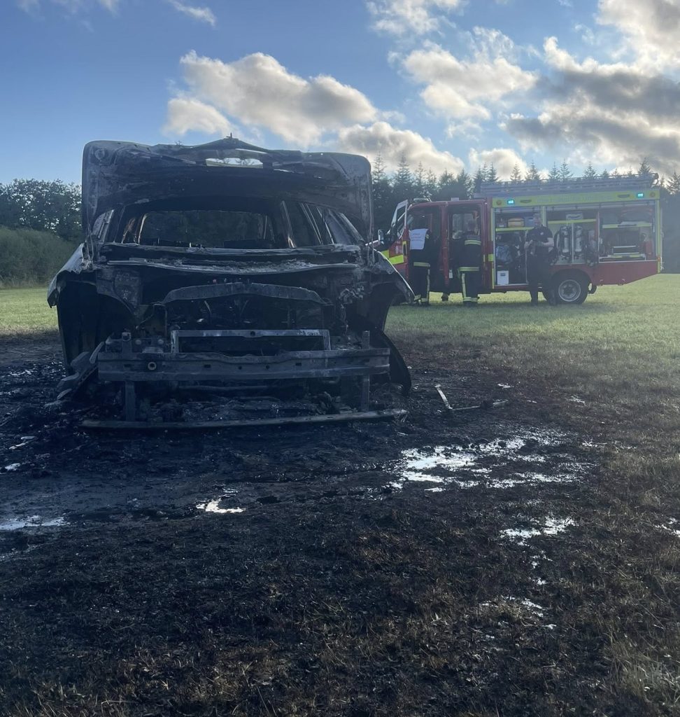Campers were left stunned after an electric car burst into flames at a Devon campsite, torching a nearby tent. Fire crews contained the blaze, but both were destroyed.