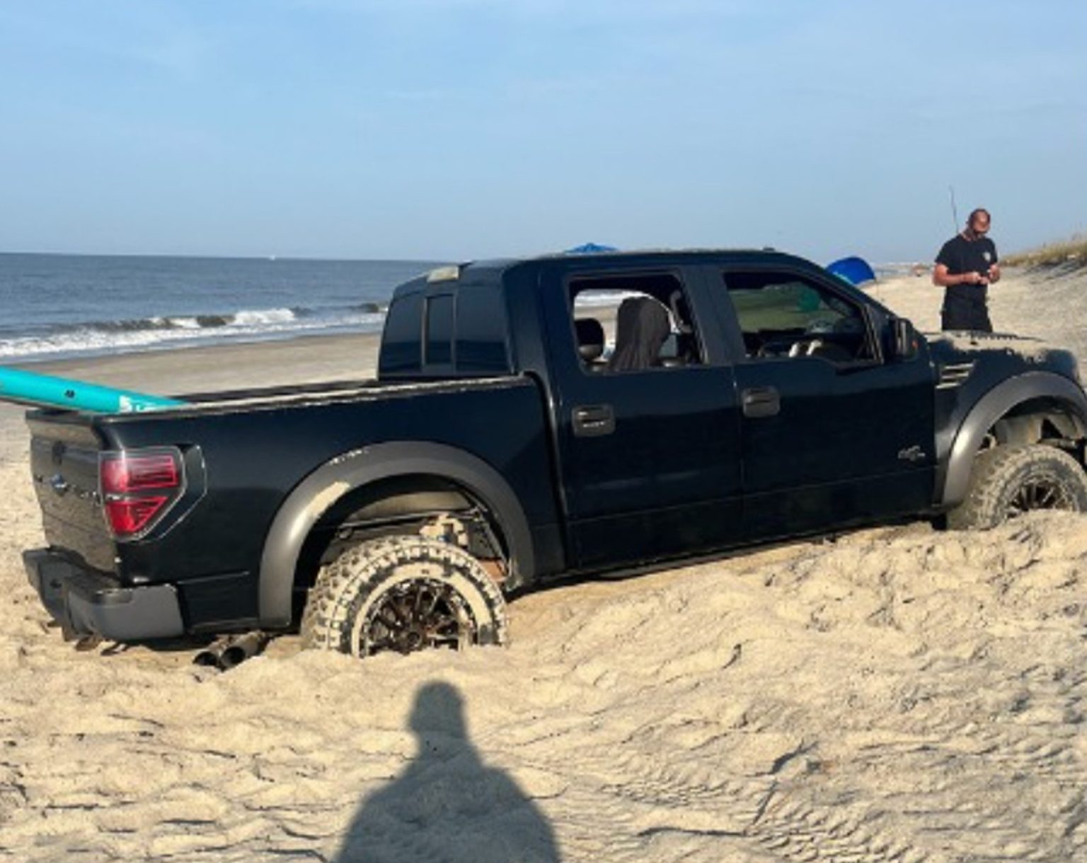 Cars got stuck in sand after driving on Oak Island beach, damaging a vital wheelchair access mat. Officials are assessing costs and drivers face multiple citations.
