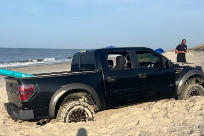 Cars got stuck in sand after driving on Oak Island beach, damaging a vital wheelchair access mat. Officials are assessing costs and drivers face multiple citations.