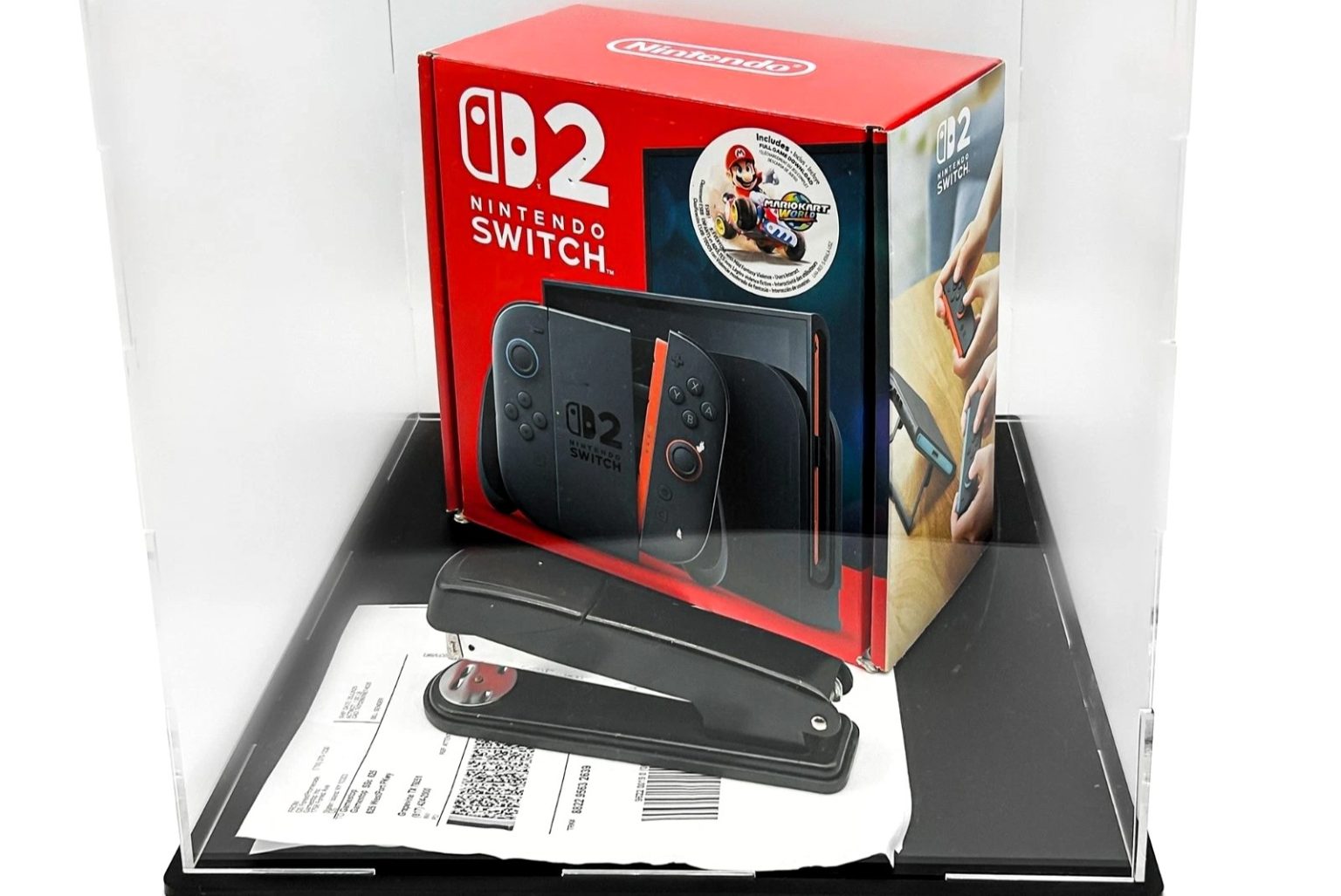 The stapler that damaged Nintendo Switch 2 consoles sold for $250,000 at auction along with a repaired console and GameStop CEO Ryan Cohen's underwear. Proceeds go to charity.