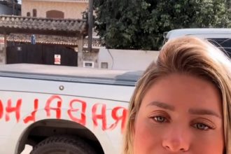 Adult content creator Débora Peixoto, 32, vows to fight back after her car was vandalised with hate in broad daylight over her career and lifestyle choices.
