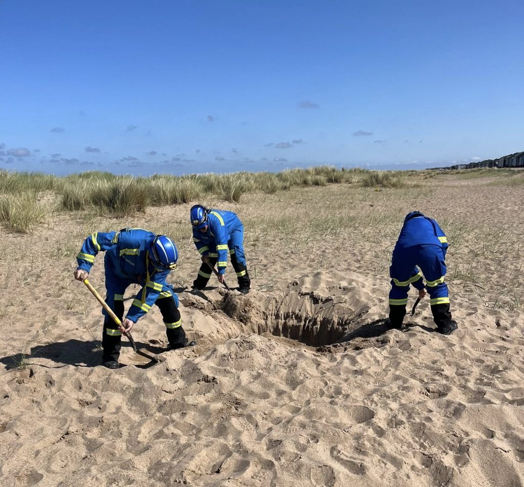 Coastguards urge beachgoers to stop digging deep holes after a 6ft pit was found in Lincolnshire, warning of entrapment and injury risks. Officials filled it in for safety.
