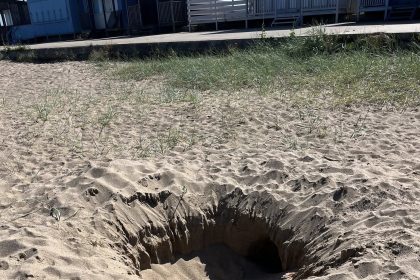 Coastguards urge beachgoers to stop digging deep holes after a 6ft pit was found in Lincolnshire, warning of entrapment and injury risks. Officials filled it in for safety.