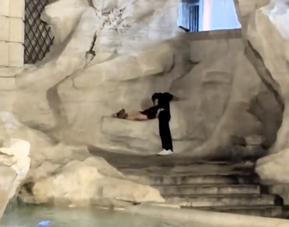 Tourists caught allegedly getting intimate atop Rome's historic Trevi Fountain spark outrage and risk heavy fines as shocked onlookers witness the late-night antics.