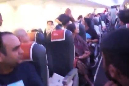 SpiceJet flight delayed 7 hours after unruly passengers try to reach cockpit - Delhi to Mumbai flight forced back to terminal as crew ensure passenger safety.