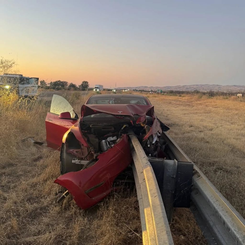 A 23-year-old driver survived with minor injuries after his Tesla, on cruise control, crashed into a guardrail on I-5 in California - front end destroyed in the smash.
