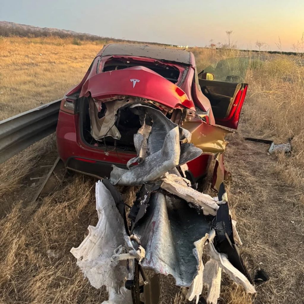 A 23-year-old driver survived with minor injuries after his Tesla, on cruise control, crashed into a guardrail on I-5 in California - front end destroyed in the smash.