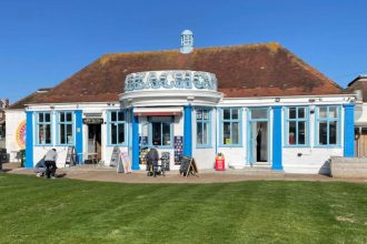 Fatboy Slim's Big Beach Cafe in Hove faces backlash over high prices and long waits, with mixed reviews praising friendly staff and seaside vibes.