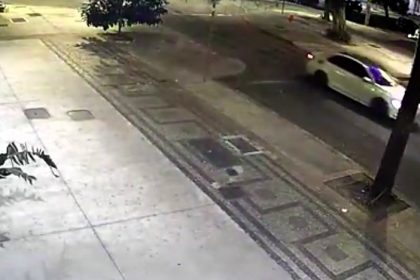 A massive tree narrowly missed a car by seconds as it fell onto a road in Belo Horizonte, Brazil - no injuries reported and firefighters cleared the scene overnight.