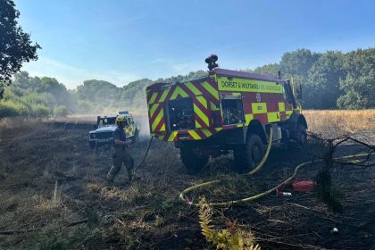 Huge 14-acre wildfire erupts in Poole forcing residents to shut windows - 75 firefighters and 15 engines battled blaze as probe launched into cause of fire.