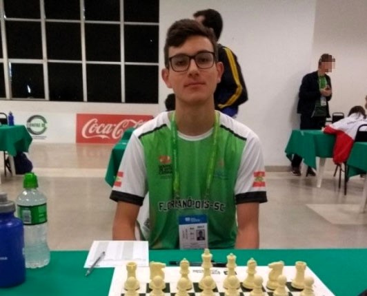 A 24-year-old chess champion, Davi Sulzbacher Gonçalves, allegedly stabbed his mother to death while she slept and calmly called the police to report the crime. He faces femicide charges.