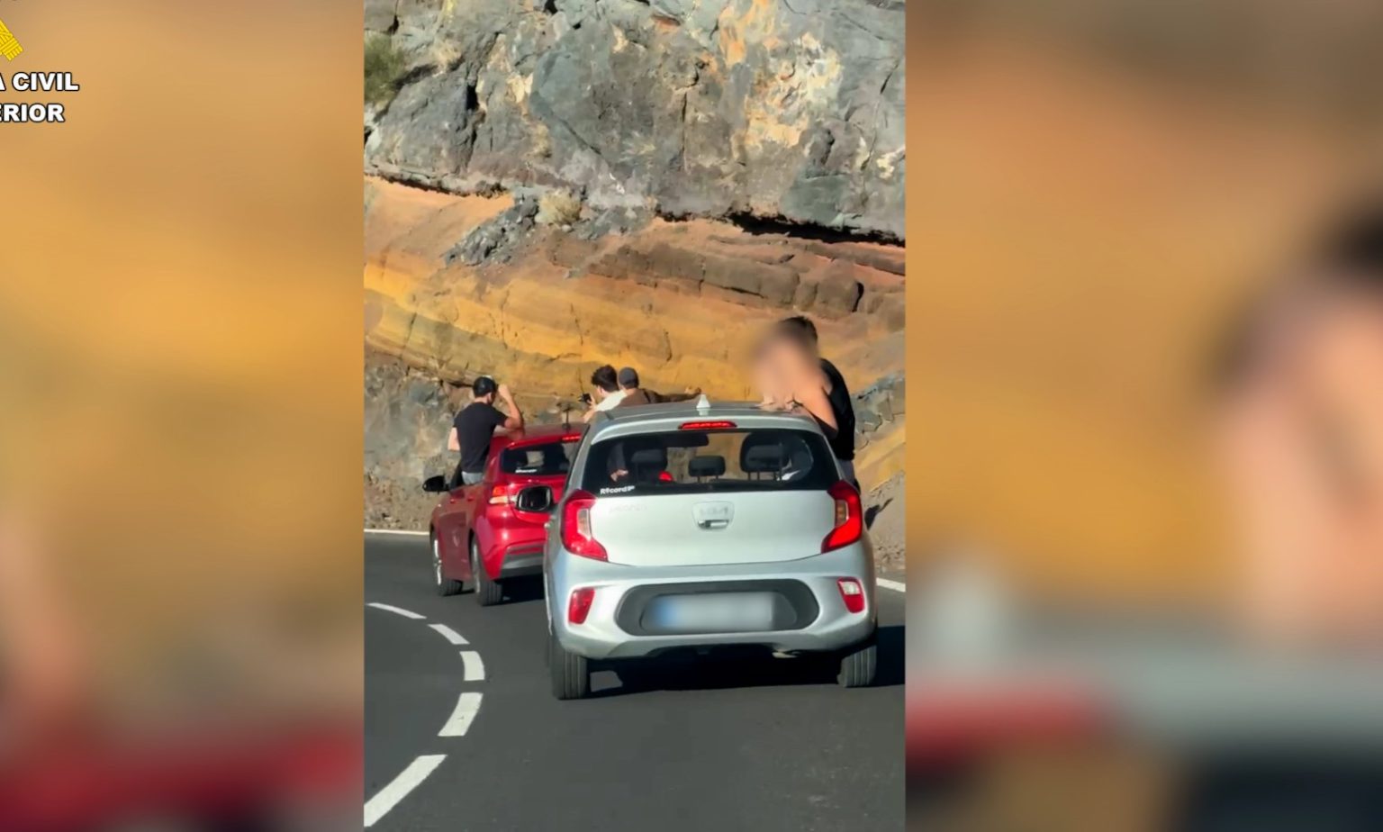 Eight tourists fined in Tenerife after being filmed hanging out of moving cars in Teide National Park - drivers hit with €500 penalties as police crack down on reckless acts.