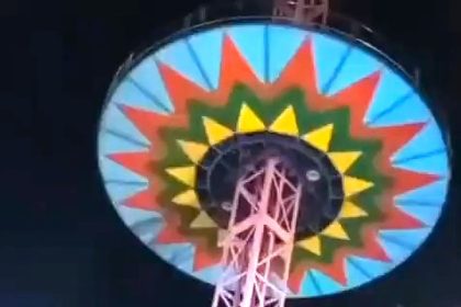 Twelve people including children injured as fairground swing ride collapses 50ft in Navsari India sending riders crashing to the ground before being rushed to hospital.