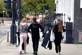 Brazen shoplifters strolled out of H&M in Islington with £400 of clothes just yards from a police station before being stopped by officers at a nearby bus stop.
