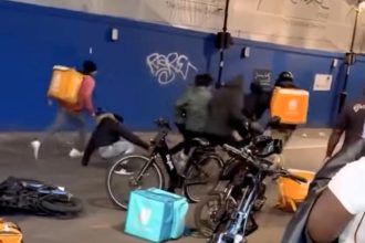 Croydon street brawl erupts as delivery riders attack man accused of bike theft - violent clash caught on video sparks outrage from locals and police probe underway.