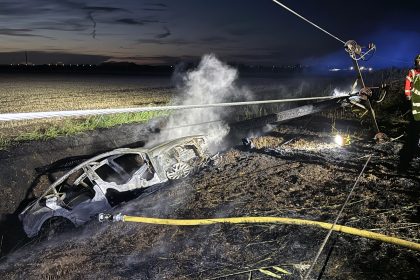 Electric car bursts into flames after crashing into pylon in Whittlesey - 35 homes left without power as fire crews battle blaze and driver miraculously escapes.