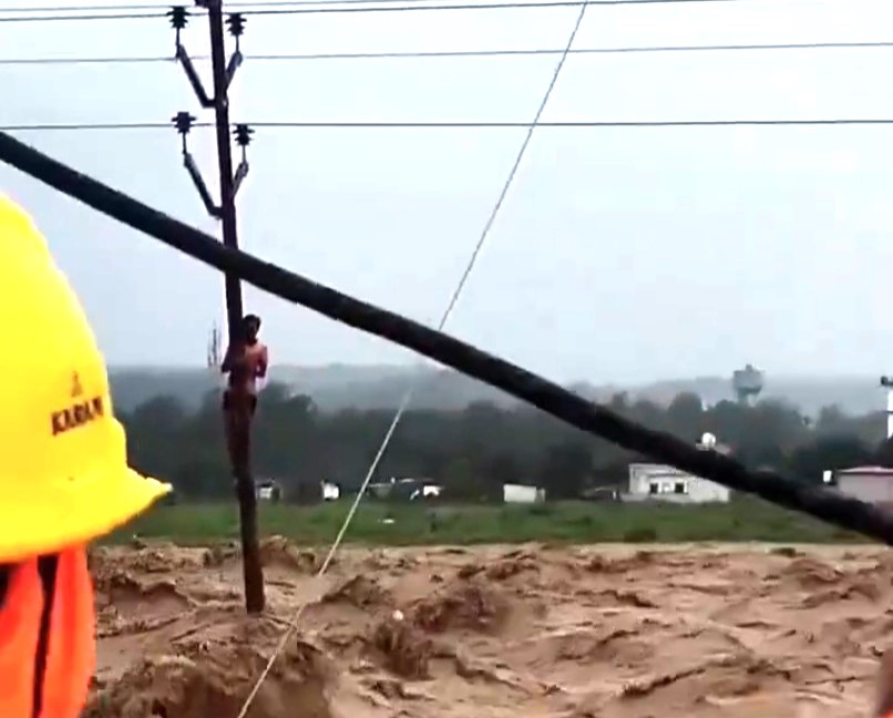 Horror floods in Uttarakhand as a river bank bursts in Dehradun - 13 dead, 16 missing and dramatic rescue of a man clinging to an electric pole for survival.