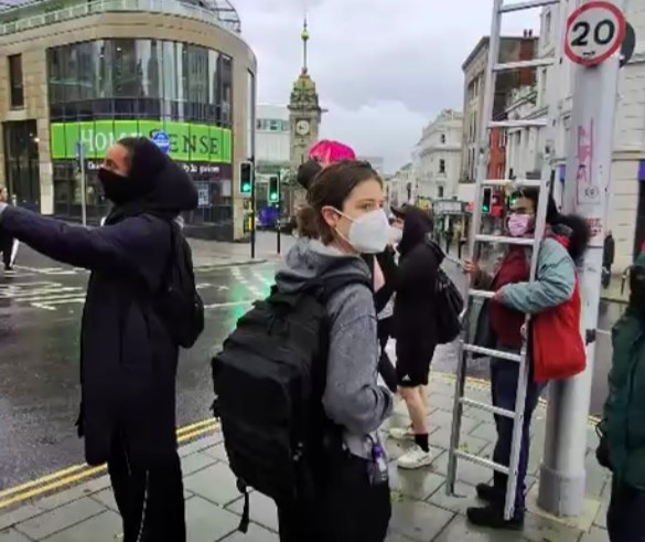 A masked mob tried removing Union Jack flags in Brighton but were confronted by a patriotic local who slammed them for disrespecting England and called them an embarrassment.