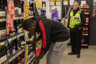 Brazen thief caught on camera stuffing wine into bag before fleeing Tesco with crate of Stella Artois in south London - shocked shopper pleads with him to stop.