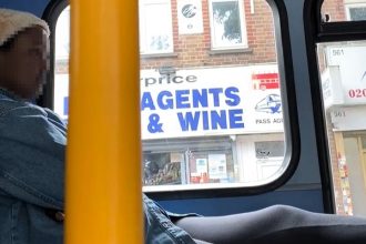 Defiant woman sparks row on London bus after mocking passengers and putting feet on seat - risking £50 fine for unhygienic behaviour on Wembley’s Number 92 service.