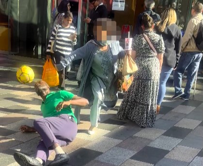 Woman slammed for rude stunt after knocking football off street performer’s head in Ilford. While he laughed it off, viewers branded her childish and disrespectful.