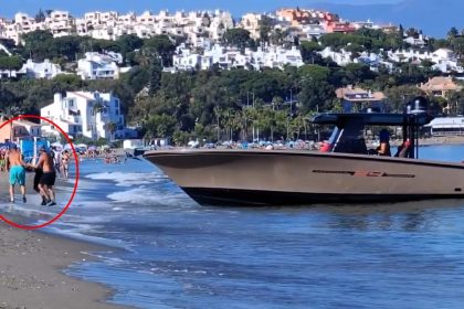 Beachgoers filmed men unloading bundles from a boat into a 4x4 on Spain’s Costa del Sol sparking debate online over whether it was a brazen drug drop or just beach gear.
