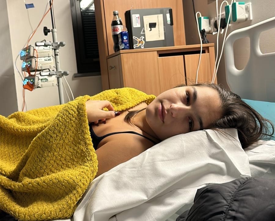 Doctors dismissed 23-year-old Leah Kalkan’s pain as “meat sweats” before scans abroad revealed a grapefruit-sized spinal tumour. She beat rare cancer after months of treatment.