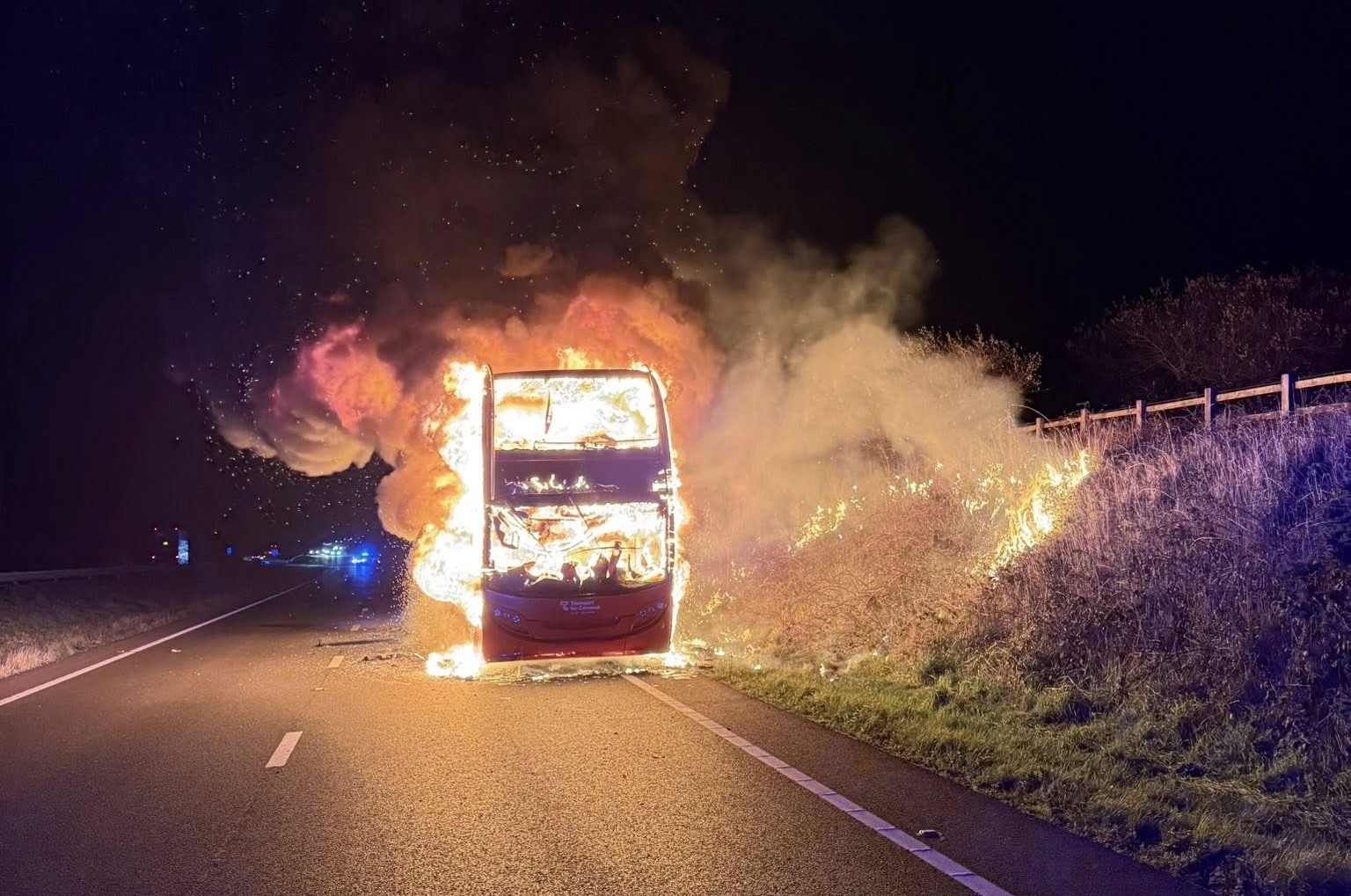 A double-decker bus burst into flames on the A30 between Launceston and Bodmin, Cornwall - firefighters tackled the huge blaze as thick smoke caused major travel disruption.