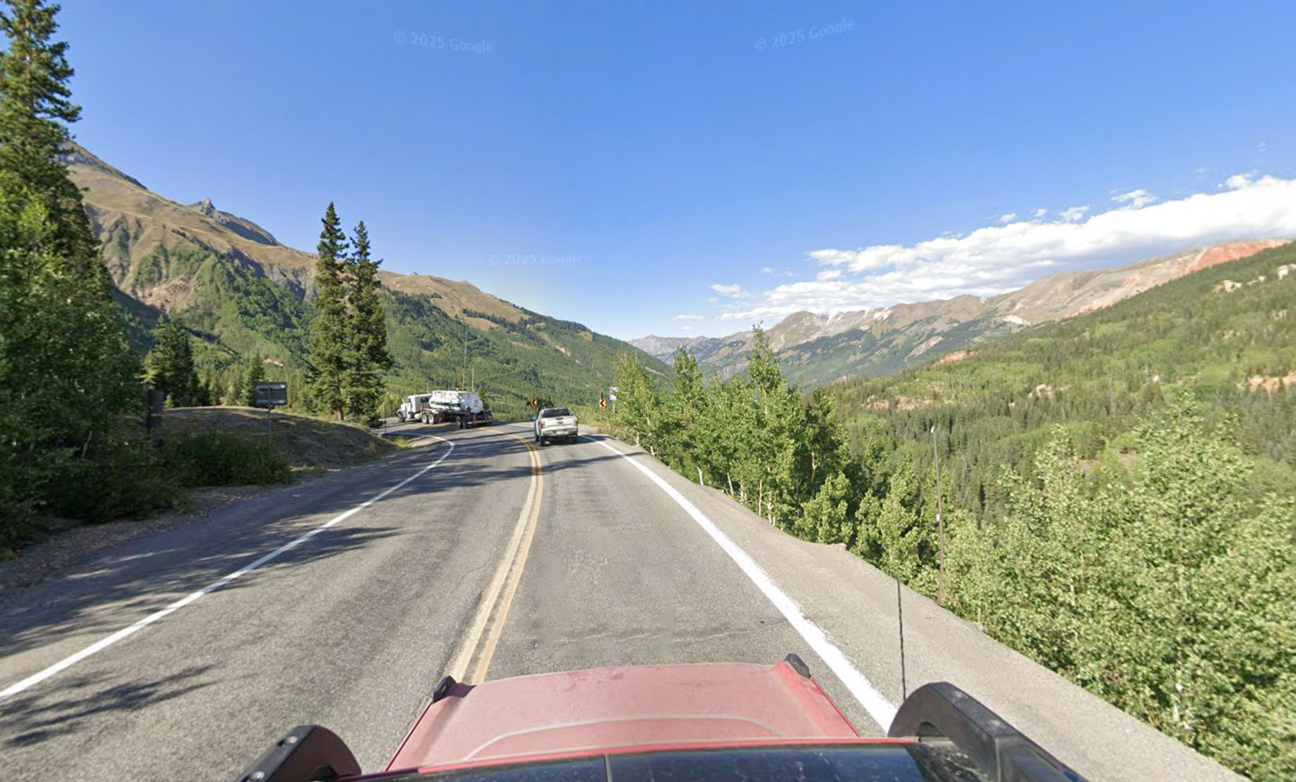 Driver miraculously survives 300ft drop after truck plunges off ...