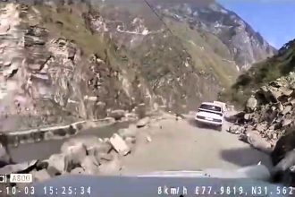 Miracle escape as giant boulder smashes into moving car in Himachal Pradesh - terrifying dashcam footage shows near miss amid deadly landslides and road chaos in India.