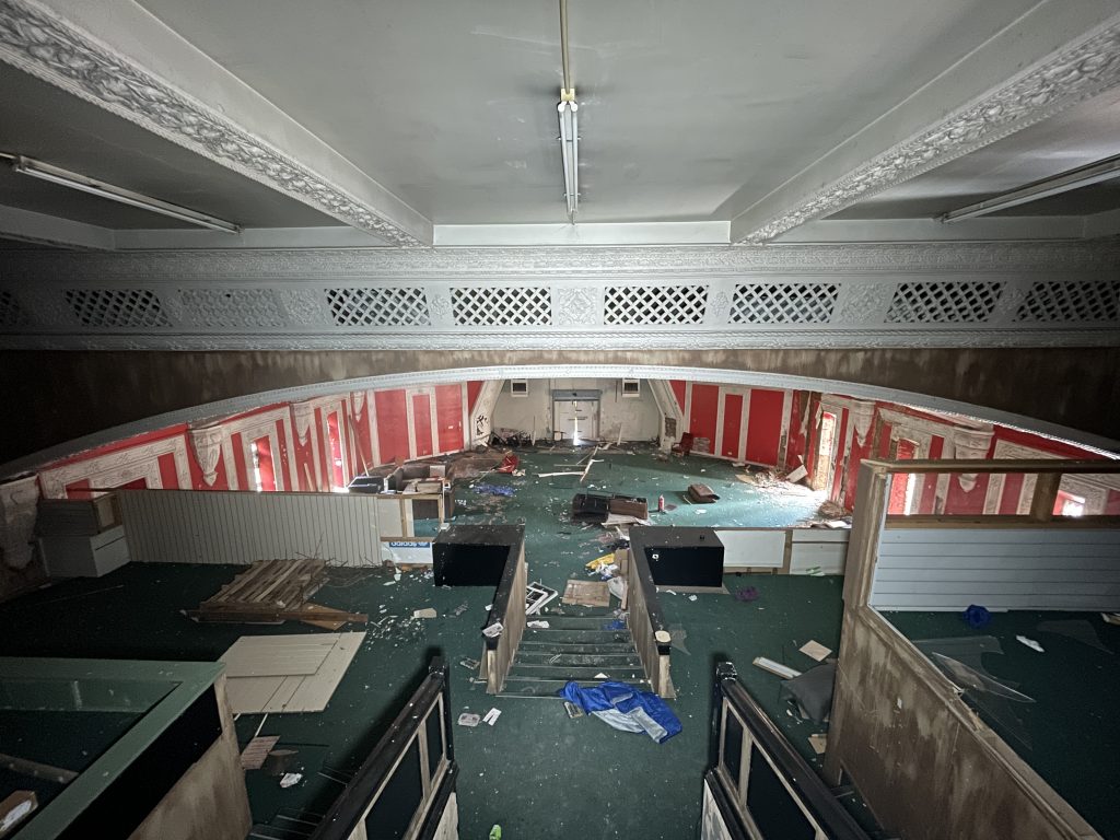 An urban explorer found a derelict museum filled with blood red warnings and a pentagram on the floor describing the eerie abandoned site as something straight out of a horror film.