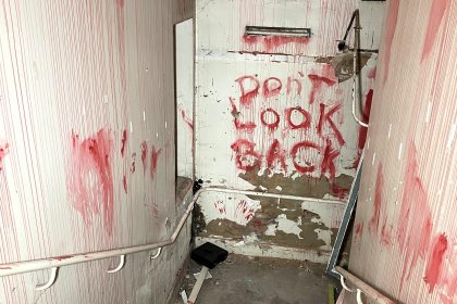 An urban explorer found a derelict museum filled with blood red warnings and a pentagram on the floor describing the eerie abandoned site as something straight out of a horror film.