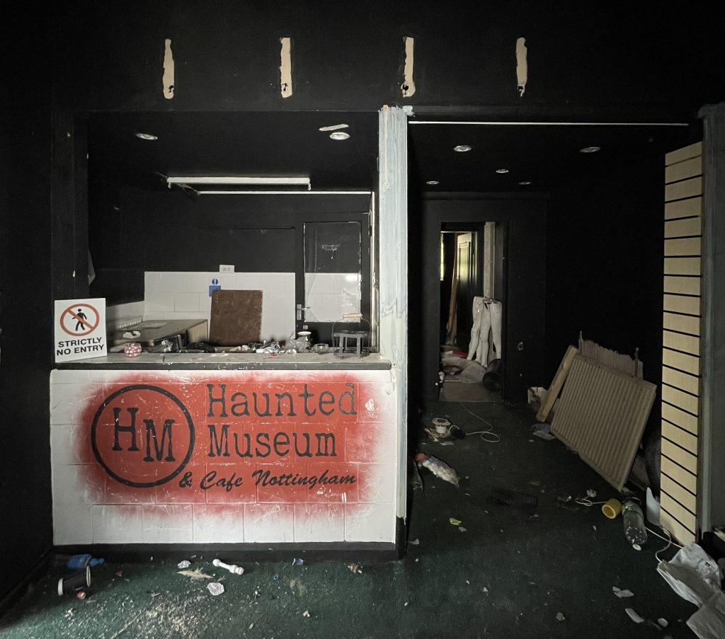 An urban explorer found a derelict museum filled with blood red warnings and a pentagram on the floor describing the eerie abandoned site as something straight out of a horror film.