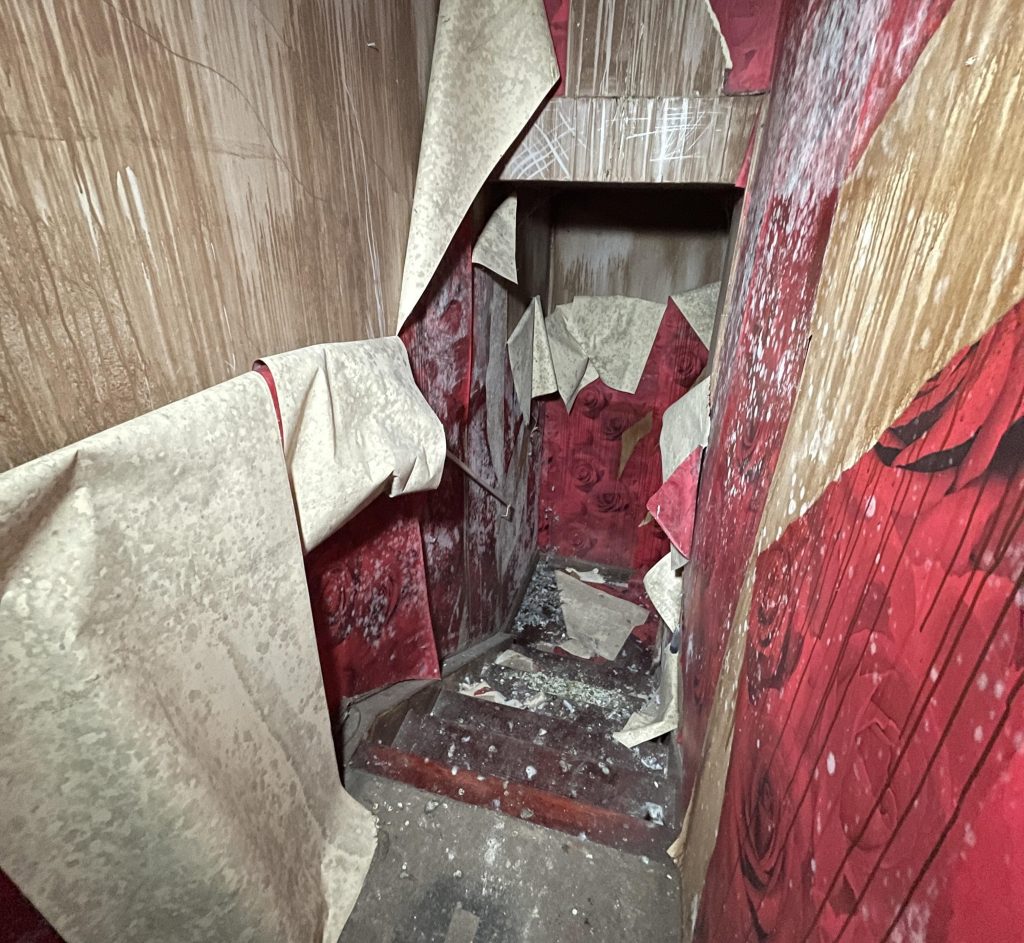 An urban explorer found a derelict museum filled with blood red warnings and a pentagram on the floor describing the eerie abandoned site as something straight out of a horror film.