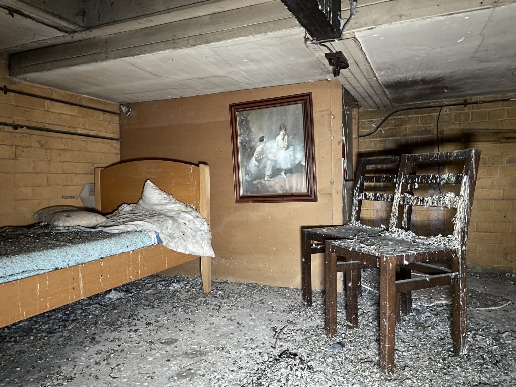 An urban explorer found a derelict museum filled with blood red warnings and a pentagram on the floor describing the eerie abandoned site as something straight out of a horror film.