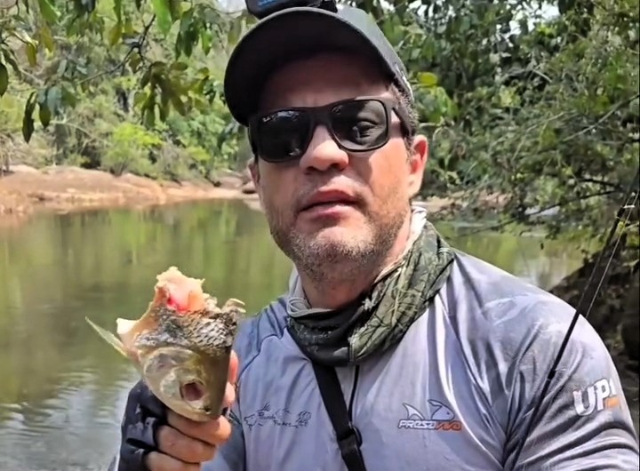 Piranhas devoured a fish moments after it was hooked in the Amazon leaving only its head as stunned anglers bizarrely decided to eat the remains raw in a survival style meal.