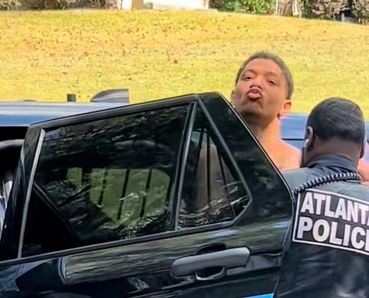 An escaped convicted murderer who was on the run for five months has been recaptured in Atlanta, Georgia, and stunned onlookers by blowing a kiss as he was led into a police car.