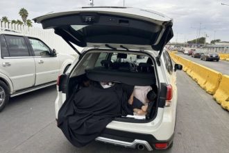 A driver in Tijuana was shocked to find three Chinese women hiding in her car boot at a US border crossing, with authorities suspecting a human smuggling attempt.