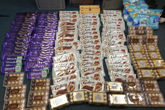 A husband and wife dubbed Bonnie and Clyde were caught with 135 stolen chocolate bars after their car was stopped by police during a nationwide shoplifting spree.