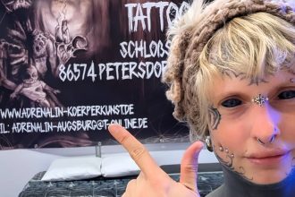 Tattoo artist Heidi Zitna from Munich has spent £17,500 transforming herself with inked eyes, piercings and skull implants, calling her body a living work of art.