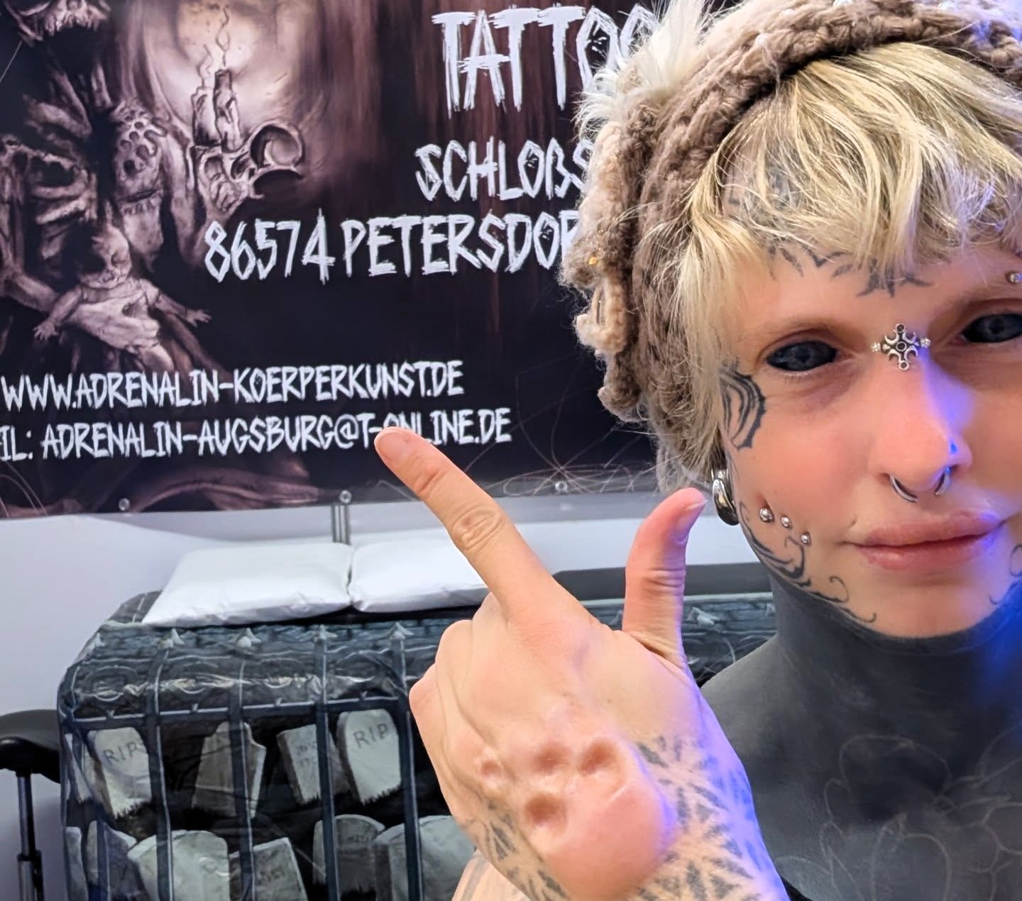 Tattoo artist Heidi Zitna from Munich has spent £17,500 transforming herself with inked eyes, piercings and skull implants, calling her body a living work of art.