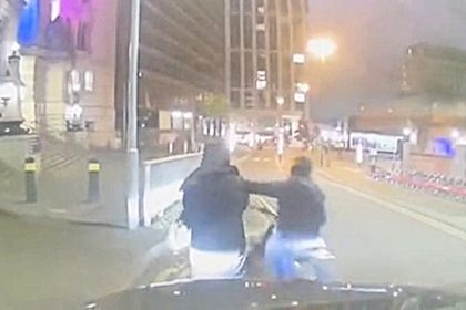 A masked thief on an E-bike tried to snatch a woman's phone outside Waterloo station at 3 am - part of London's soaring phone theft crisis caught on shocking video.